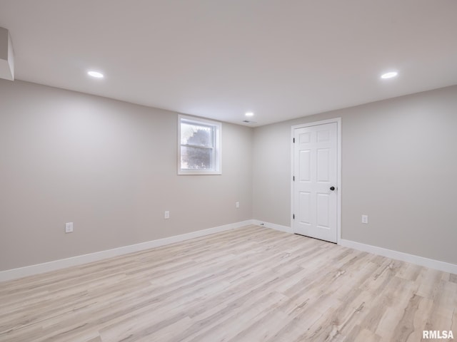 basement featuring light wood-type flooring