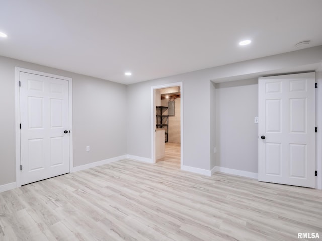 basement featuring light wood-type flooring