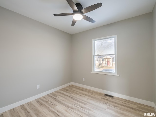 spare room with light hardwood / wood-style flooring and ceiling fan