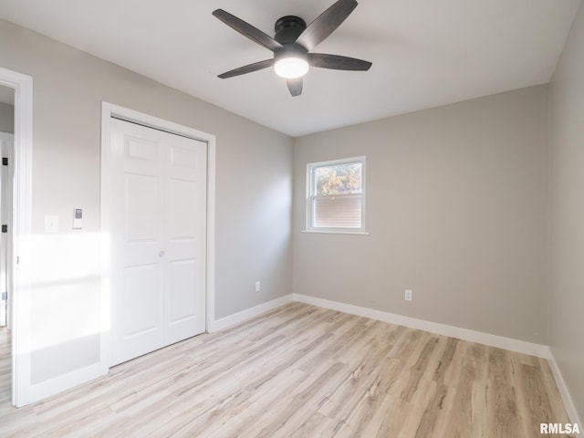 unfurnished bedroom with a closet, ceiling fan, and light hardwood / wood-style flooring