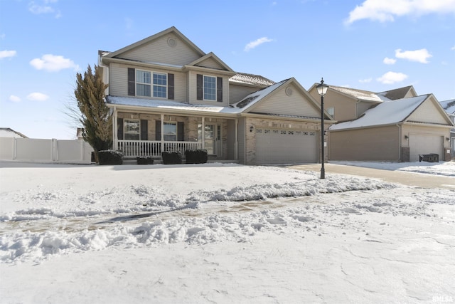 front of property with covered porch and a garage