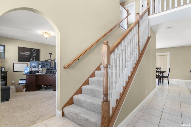 staircase featuring carpet floors