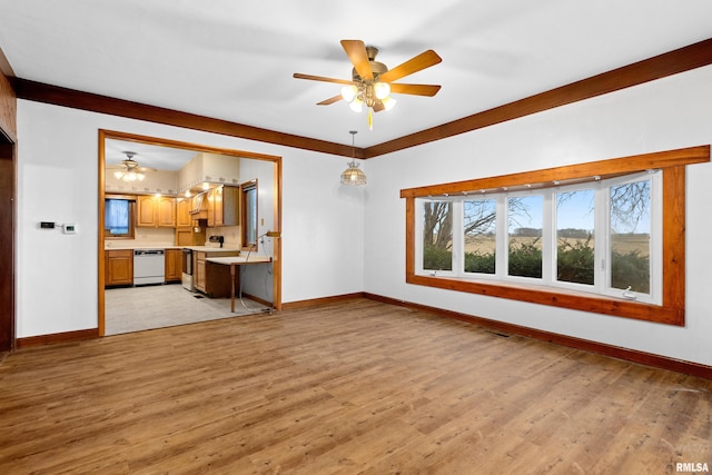 unfurnished living room with ceiling fan and light hardwood / wood-style flooring