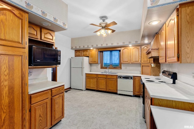 kitchen with sink, backsplash, ceiling fan, and black appliances