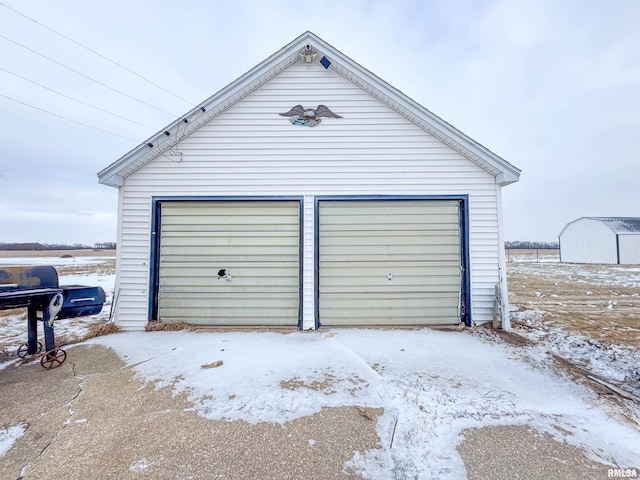 view of snow covered garage