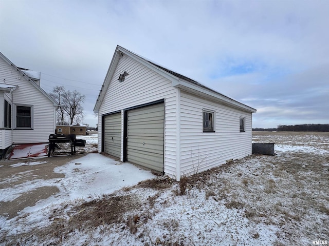 view of snow covered garage