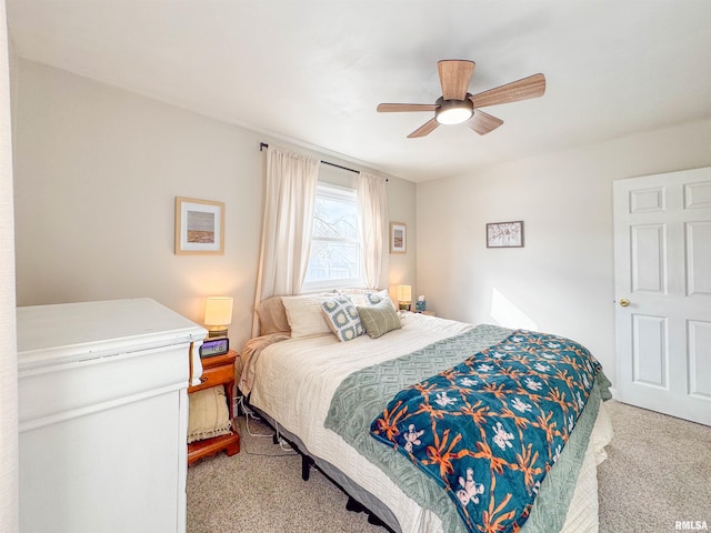 bedroom with light colored carpet and ceiling fan