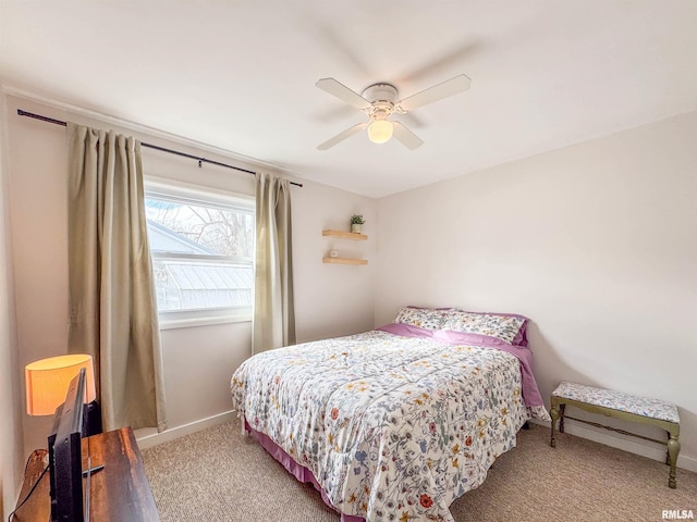 bedroom with ceiling fan and light carpet