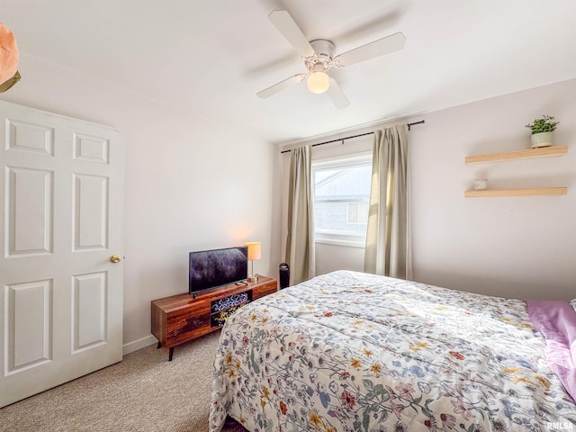 bedroom with light colored carpet and ceiling fan