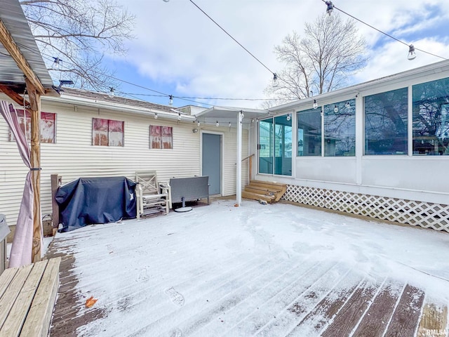 snow covered deck with grilling area