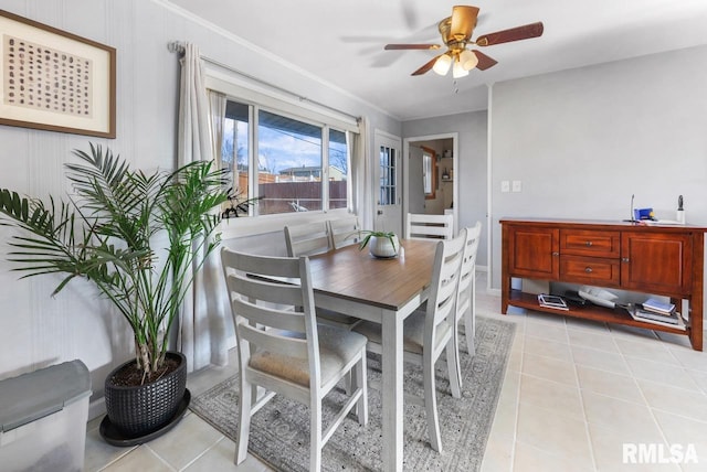 dining area with light tile patterned flooring and ceiling fan