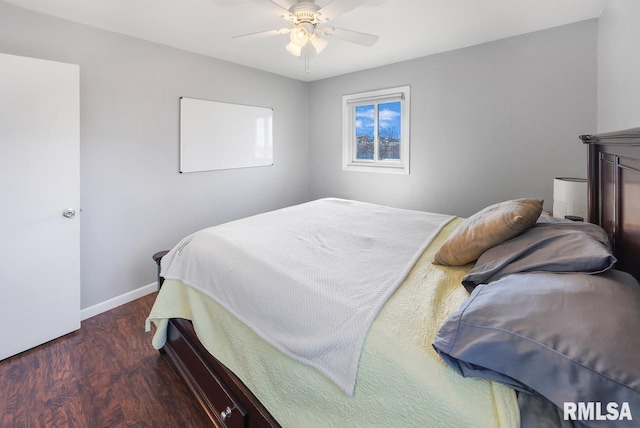 bedroom featuring ceiling fan and dark hardwood / wood-style floors