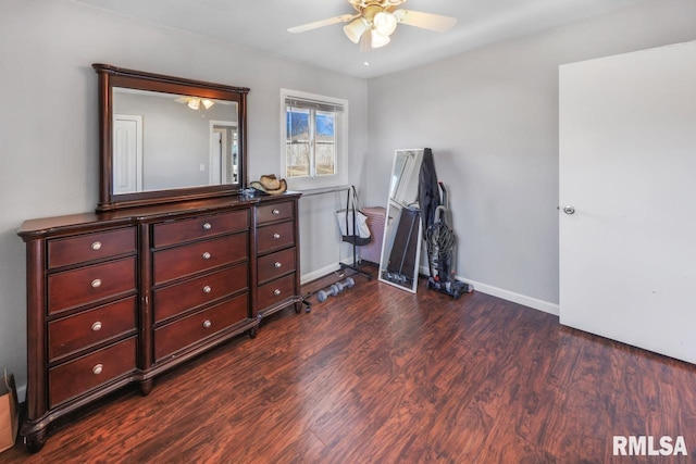 misc room with ceiling fan and dark hardwood / wood-style flooring