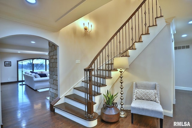 stairway with hardwood / wood-style flooring