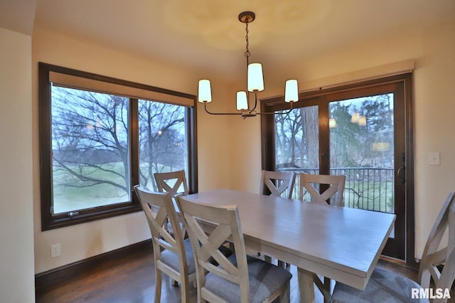 dining room featuring dark hardwood / wood-style flooring and plenty of natural light