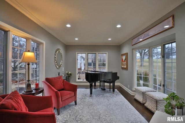 sitting room with crown molding and dark hardwood / wood-style floors