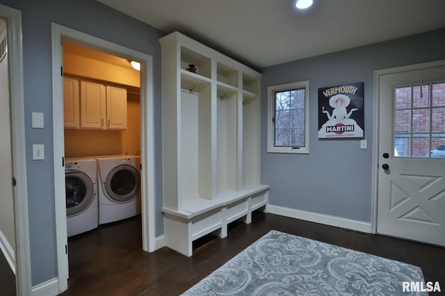 mudroom featuring dark wood-type flooring and washing machine and clothes dryer