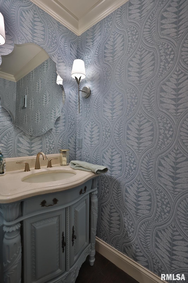 bathroom featuring ornamental molding and vanity