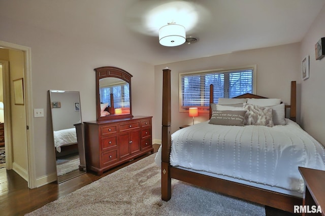 bedroom featuring dark hardwood / wood-style floors