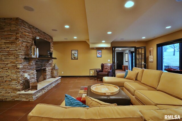 living room featuring tile patterned flooring and a fireplace