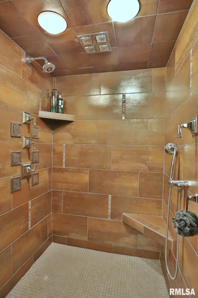 bathroom with tiled shower