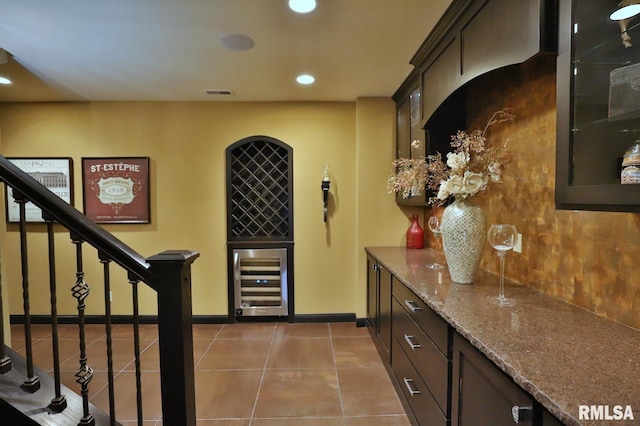 interior space featuring indoor bar and wine cooler