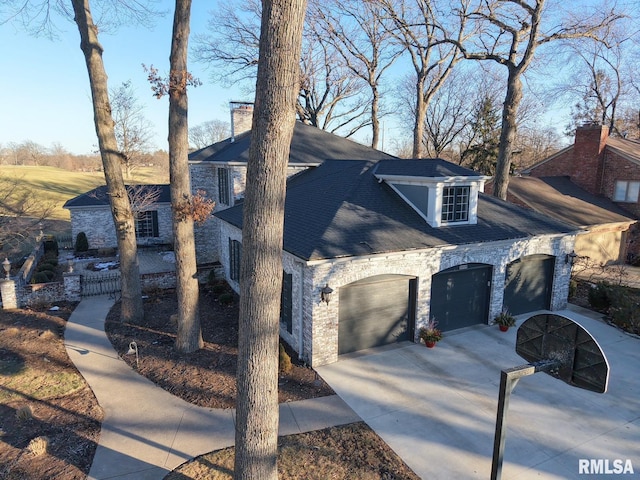 view of side of home featuring a garage