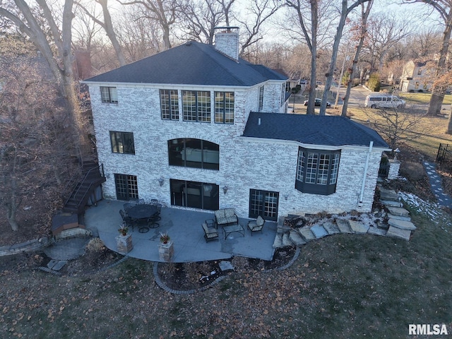 back of house featuring a patio area