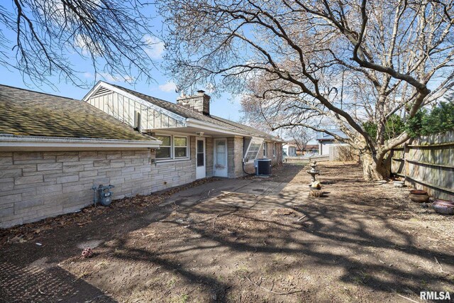 view of side of property with a yard