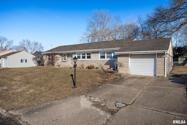 ranch-style house with a garage and a front lawn