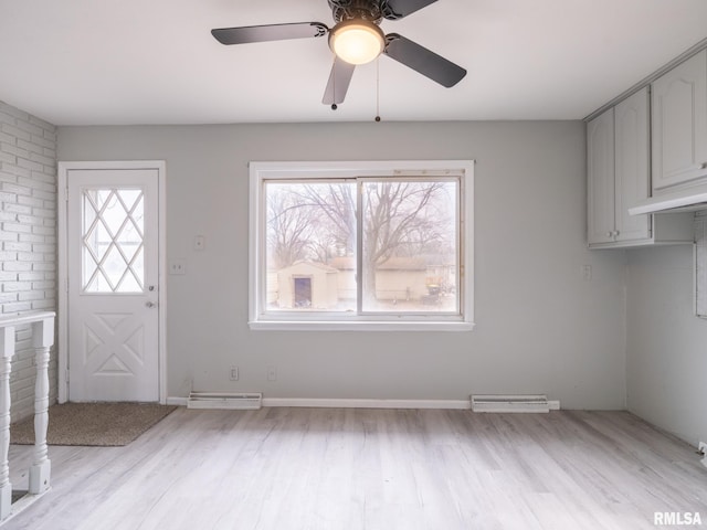 entryway with ceiling fan and light hardwood / wood-style flooring