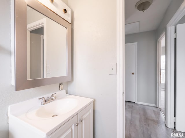 bathroom featuring hardwood / wood-style flooring and vanity