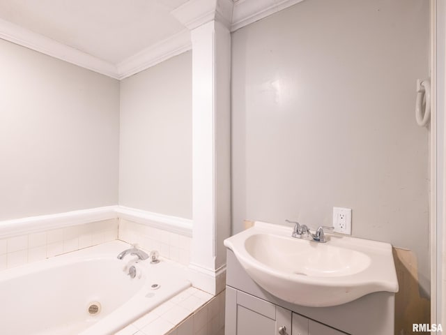 bathroom featuring crown molding, vanity, and tiled tub