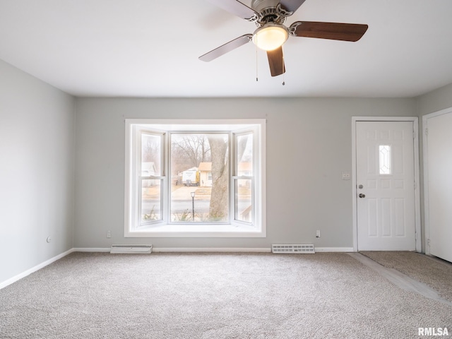 interior space with ceiling fan