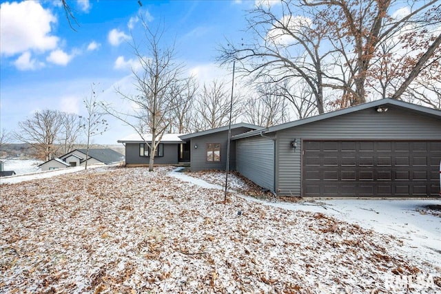 ranch-style home featuring a garage