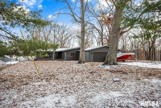 single story home featuring a garage