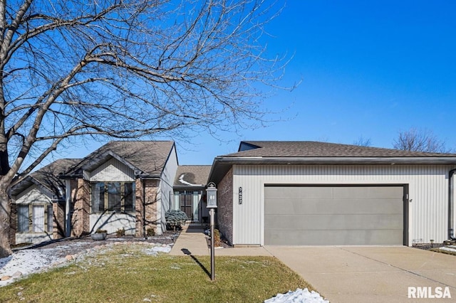 view of front of house with a garage and a front lawn