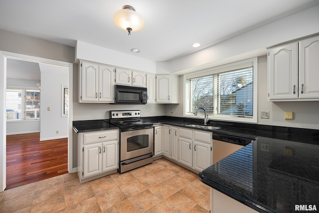 kitchen with white cabinetry and stainless steel appliances