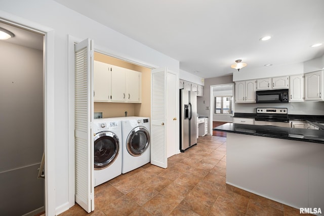 laundry area with cabinets and washing machine and dryer