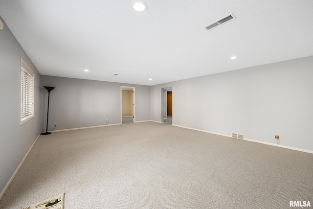 empty room featuring light colored carpet