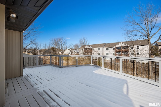 view of snow covered deck