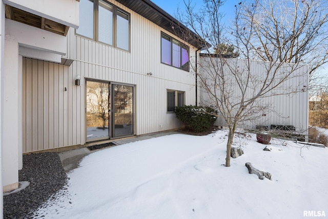 view of snow covered house