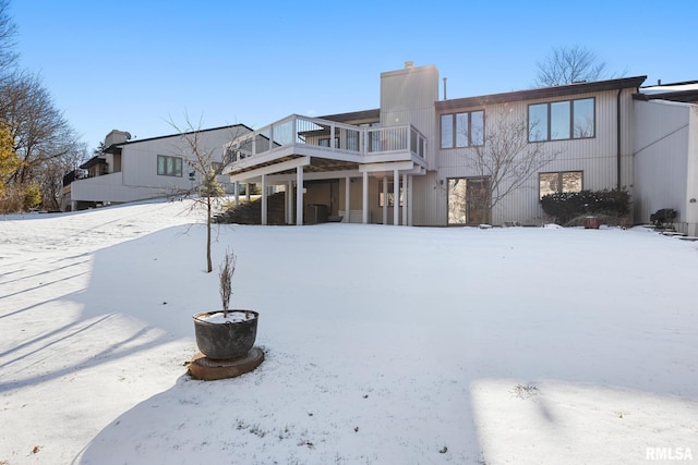 view of snow covered house