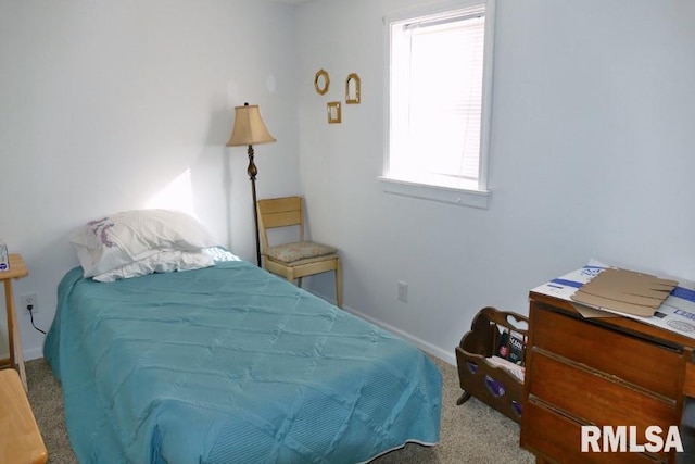 carpeted bedroom featuring multiple windows