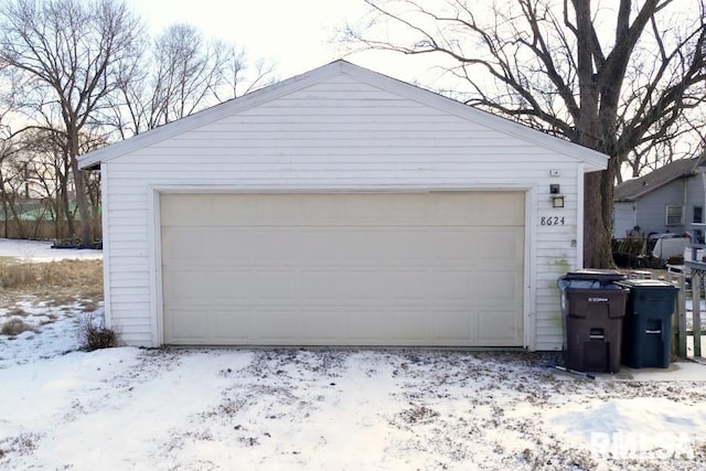 view of snow covered garage