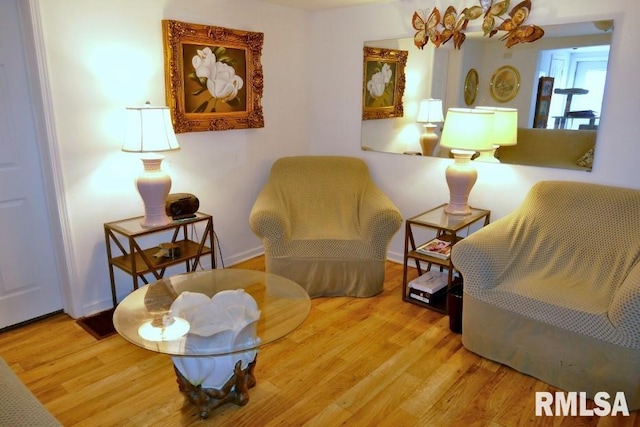 sitting room with hardwood / wood-style floors