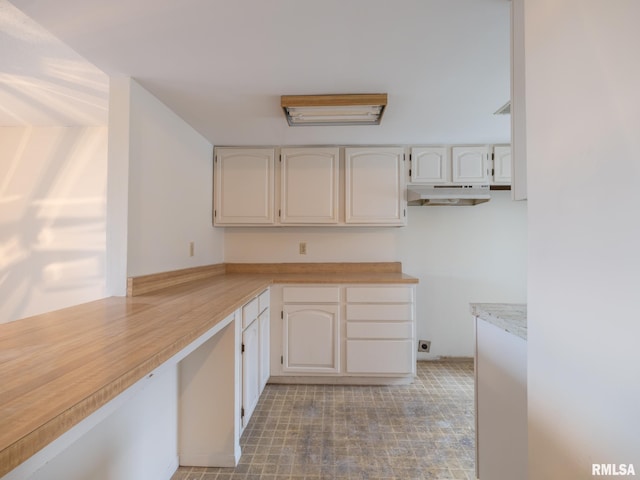 kitchen featuring white cabinetry