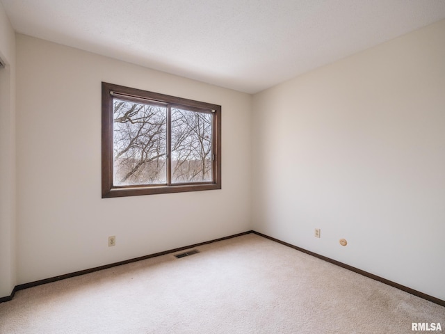 view of carpeted spare room