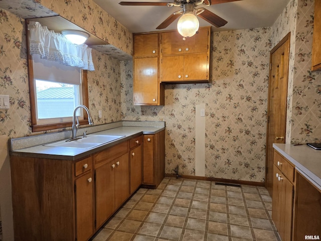 kitchen with ceiling fan and sink