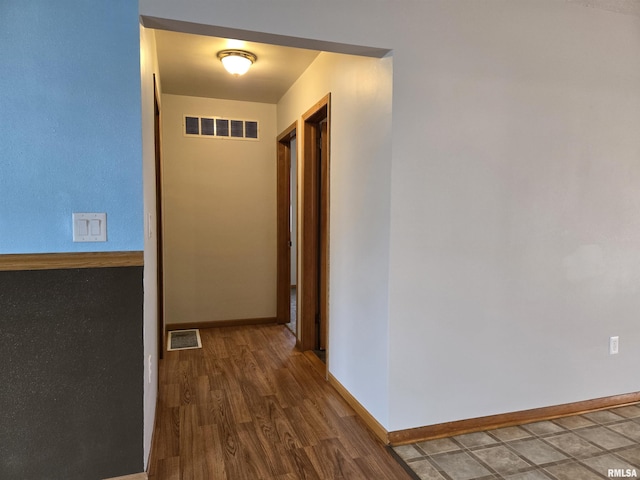 hallway featuring hardwood / wood-style floors